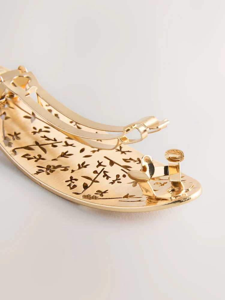 Gold-colored floral detail hair clip