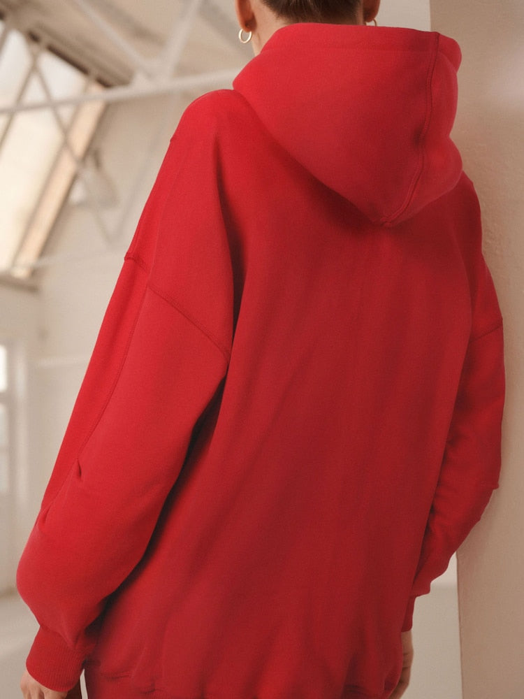Cherry red - Long-cut hooded sweatshirt in a relaxed fit
