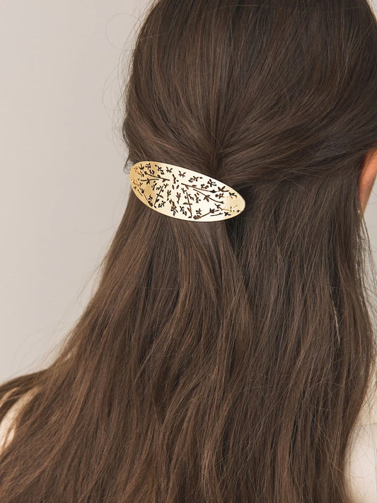 Gold-colored floral detail hair clip