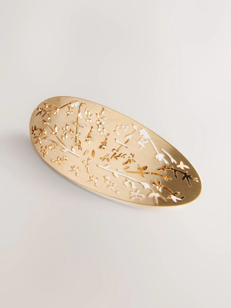 Gold-colored floral detail hair clip