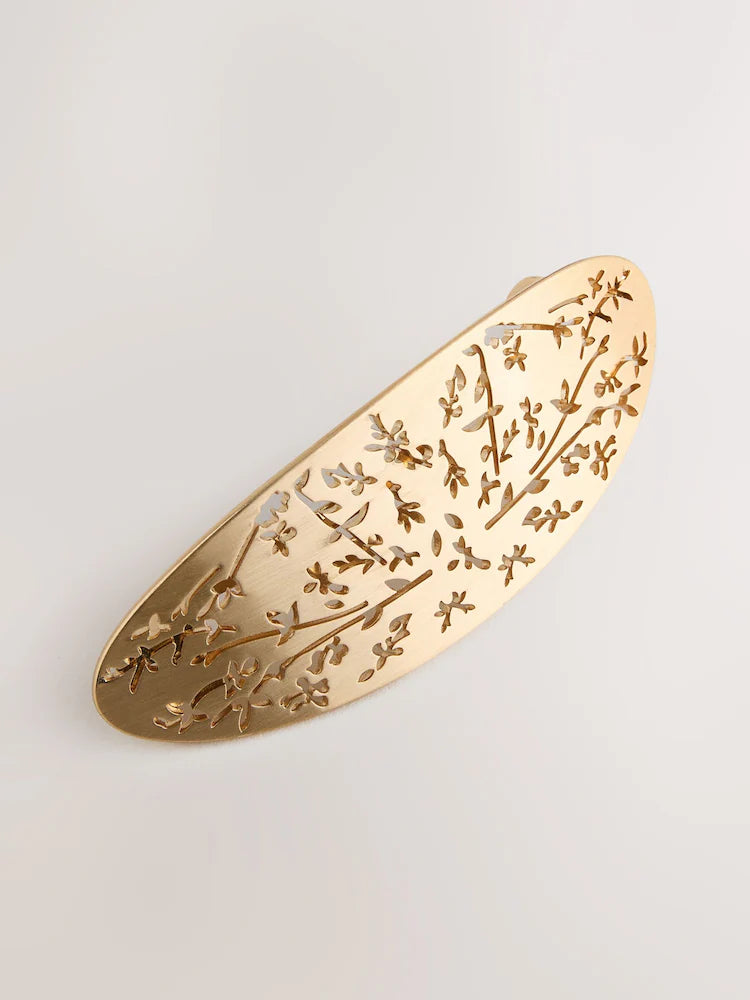 Gold-colored floral detail hair clip