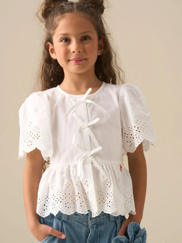 White - Angel & Rocket Ria blouse with eyelet embroidery, tie front and peplum