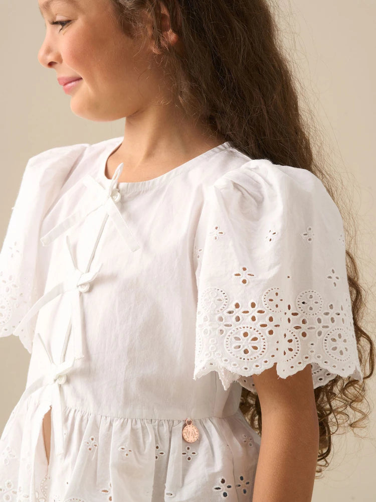 White - Angel & Rocket Ria blouse with eyelet embroidery, tie front and peplum