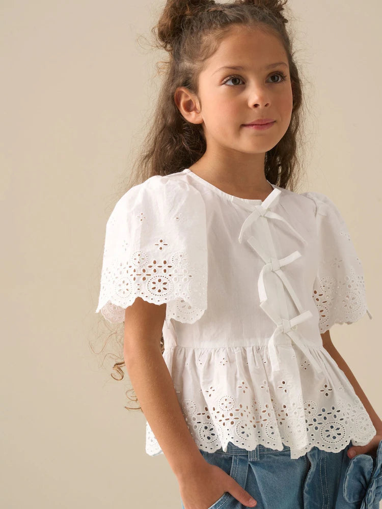 White - Angel & Rocket Ria blouse with eyelet embroidery, tie front and peplum