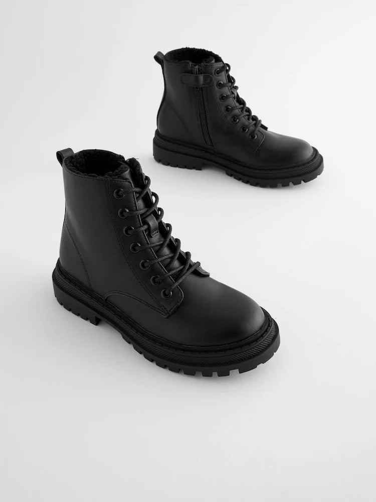 Matte black ankle boots with warm lining and lacing.