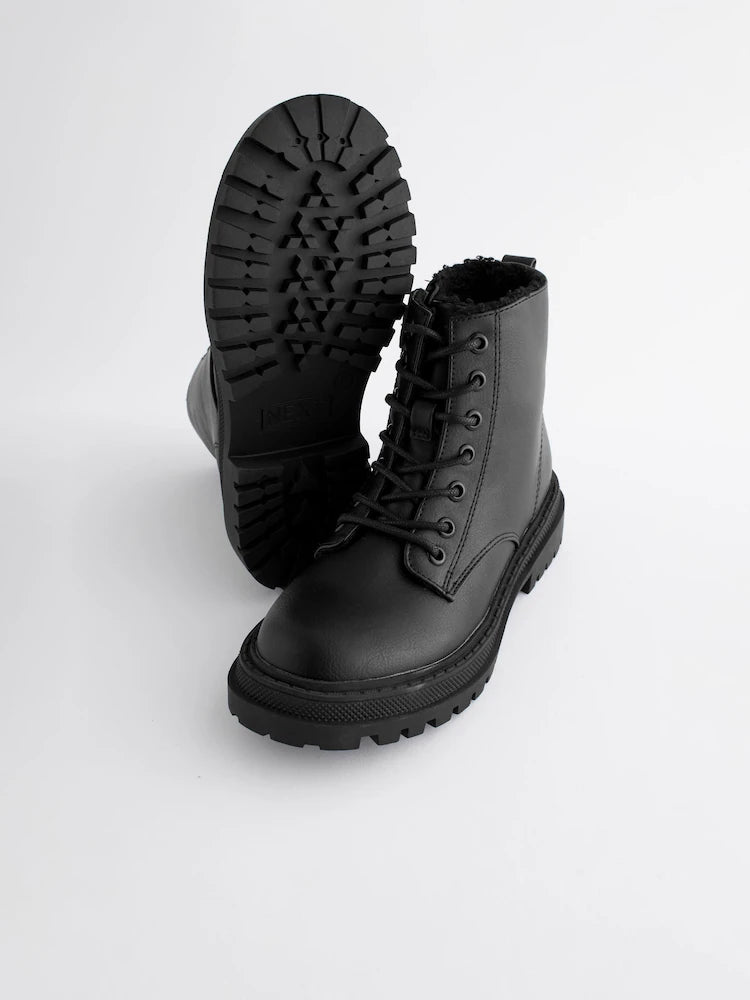 Matte black ankle boots with warm lining and lacing.