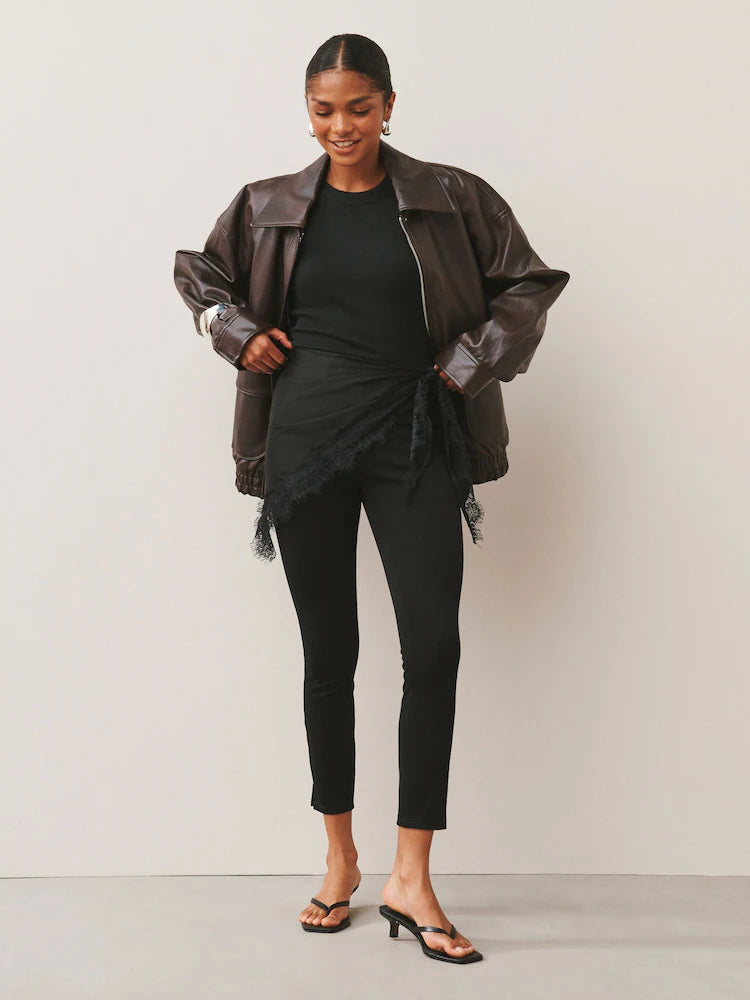 Black denim jersey leggings with a cropped fit