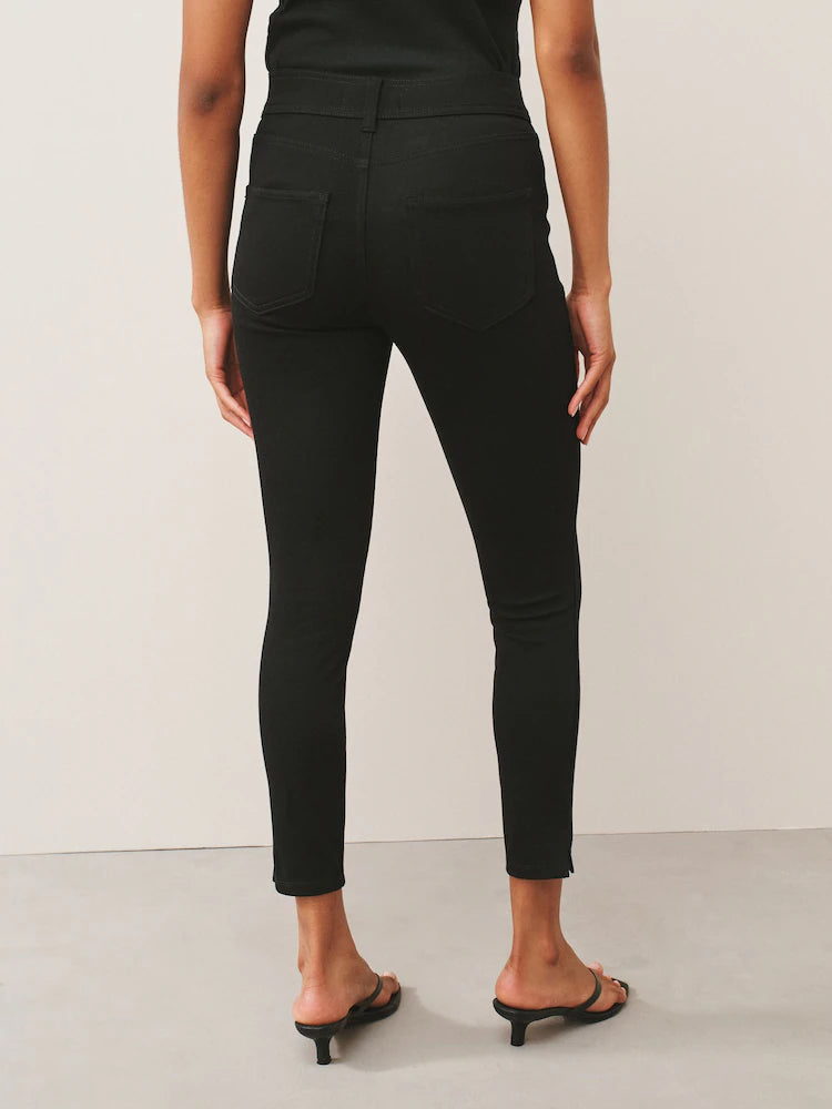 Black denim jersey leggings with a cropped fit