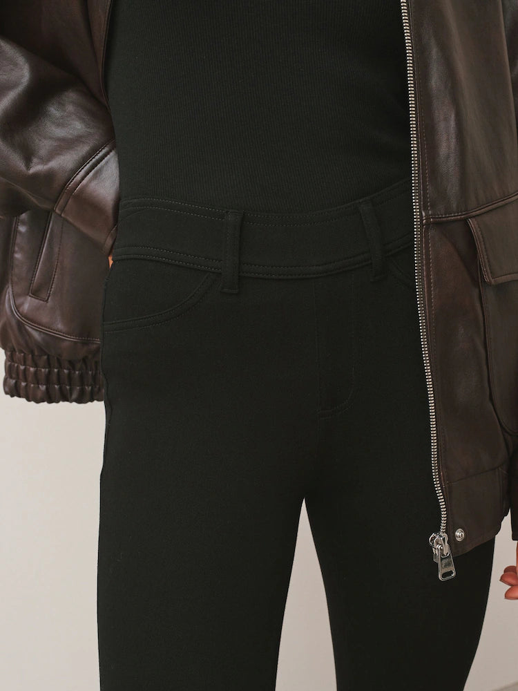 Black denim jersey leggings with a cropped fit