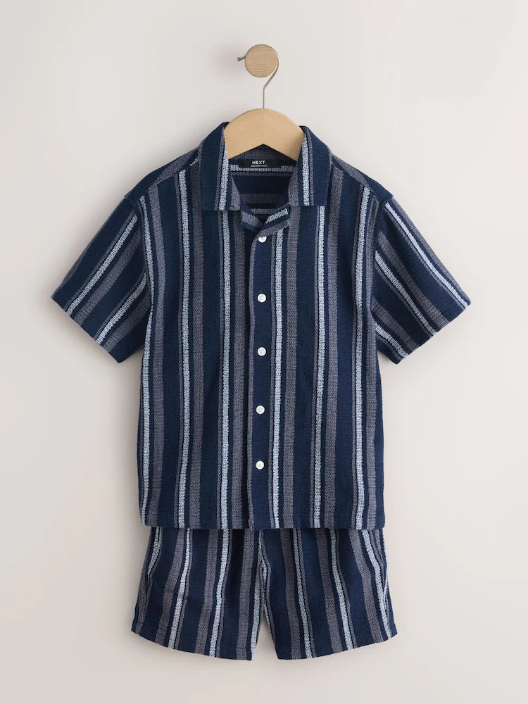 Navy blue/white set consisting of a short-sleeved shirt and shorts with textured stripes