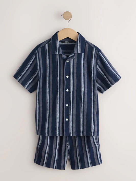 Navy blue/white set consisting of a short-sleeved shirt and shorts with textured stripes