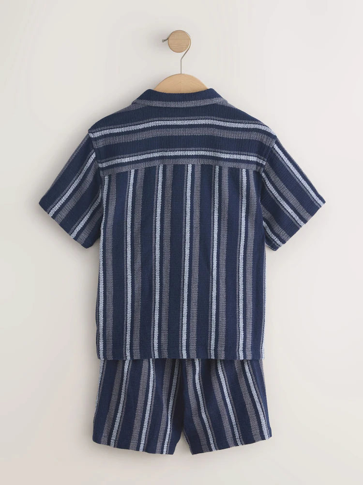 Navy blue/white set consisting of a short-sleeved shirt and shorts with textured stripes