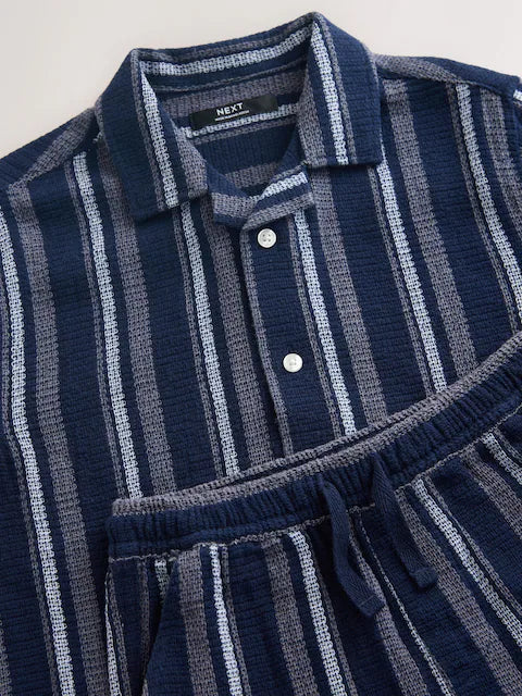 Navy blue/white set consisting of a short-sleeved shirt and shorts with textured stripes